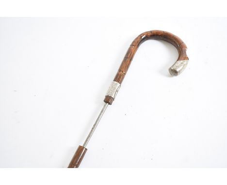 A Victorian sword stick, having silver terminal and collar marked E.B April 13th 1912, with concealed square shaped tapering 