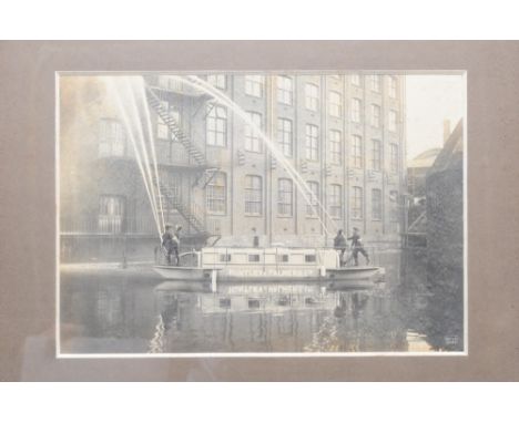 Huntley and Palmers Ltd,  gelatin silver print of Huntley and Palmers Ltd fire brigade river tender, with crew manning four h