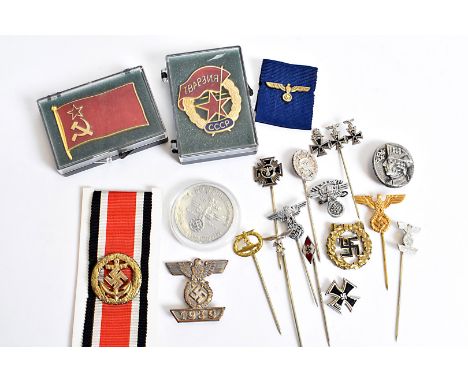 A selection of Third Reich stick pins, including Motor Corps NSKK, Silver Wound, Hitler Youth, Eagles, NSDAP 15 year long ser
