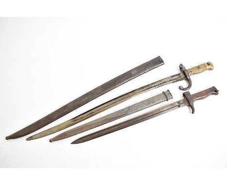 A French Chesspot bayonet, serial 14781, with metal scabbard, serial 66556, together with a French Berthier bayonet, serial 9