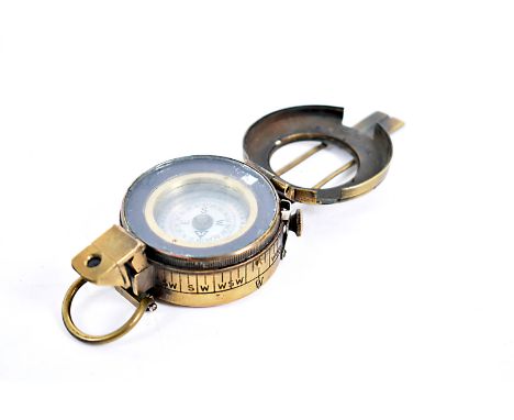 An inter-war brass compass, dated 1934,  marked Comp. Prism, Liq Mk3A, RG No.AK7015, 6605-000009 O.F.D, with mother of pear d
