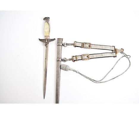 A Third Reich Government Official's dagger, with simulated mother of pearl grip, eagle's head pommel, cross guard with eagle 