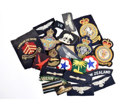 A collection of British cloth badges, various ages, including RAF, Naval, Army, Bullion etc, together with some epaulettes (p