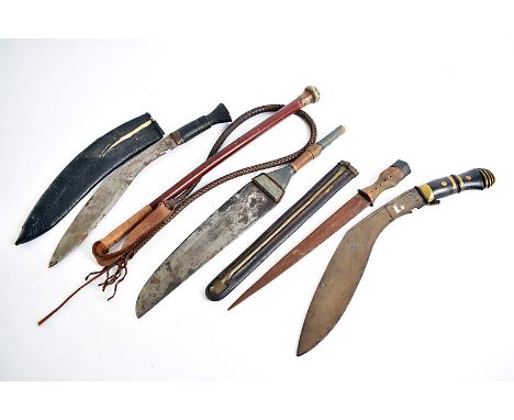 Two Middle Eastern Kukri knives, one having wooden handle with brass inlay, the other has the scabbard, together with the hea