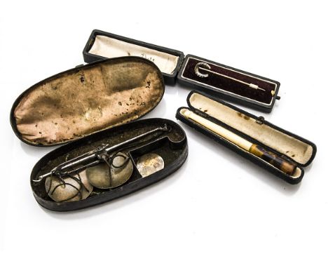 Various Items,  horseshoe stick pin stamped 15ct, in case, cigarette holder, and early 19th Century pocket scales in oval tin