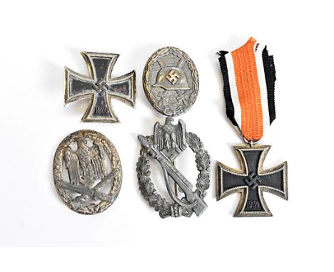 A World War Two Iron Cross 1st Class, pin back, marked L/50, together with a World War Two Iron Cross 2nd Class, marked 55 to
