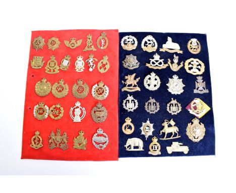 An assortment of Cap badges, including Royal Hampshire, Loyal North Lancashire, Hertfordshire, Royal Malta Militia, Royal Eng