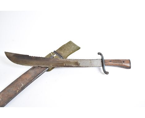 A German Sawback machete by Alcosa, Solingen, marked AWS on scales to the blade, complete with steel scabbard and frog 