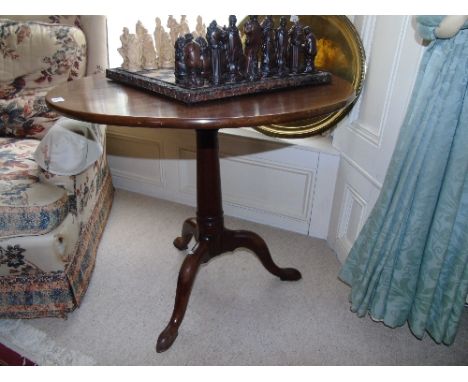 A Georgian Mahogany Circular Tilt Top Table, tripod base on pad foot. Diam. 30ins.