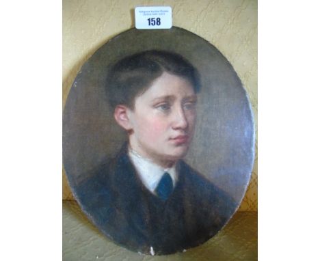 An Oval Oil on Board. Portrait of a Young Man. Unframed, 25 x 20.5cm.