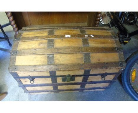 A 19th Century Oak and Metal Bound Travel Trunk with doomed top. 