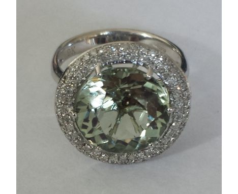 A 9ct. Diamond and Topaz Cluster Ring. Size R.