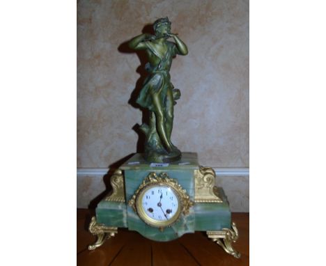 A 19th Century Alabaster and Ormolu Mantle Clock with classical maiden playing a flute.