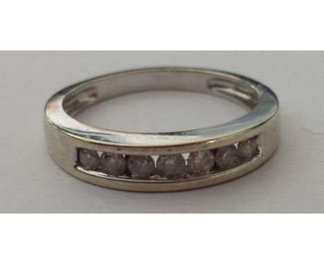 A White Gold Diamond Ring. Size J. 