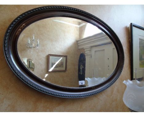 An Early 20th Century Oval Wall Mirror, along with a Barometer (2).
