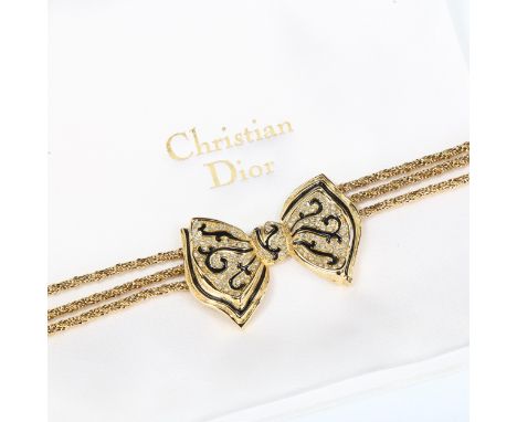 CHRISTIAN DIOR - a Vintage gold plated ribbon bow tie necklace, black enamel and paste accents, length 47cm, 71.4g, boxedNo d