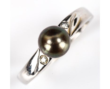 A modern 14ct white gold black cultured pearl and diamond dress ring, pearl diameter 6.8mm, size Q, 3.2gNo damage or repairs,