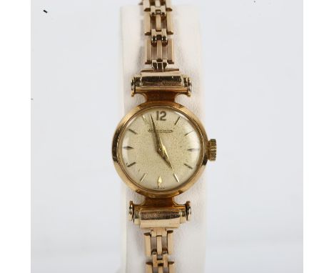 JAEGER LECOULTRE - a lady's Vintage 9ct gold mechanical bracelet watch, silvered dial with gilt baton hour markers and 9ct br