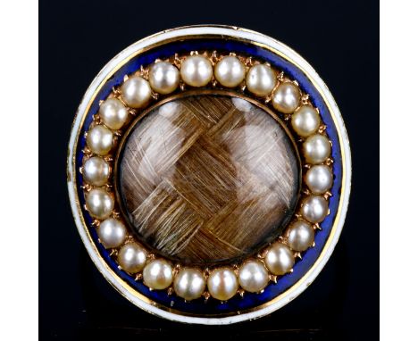 A Georgian rose gold enamel and pearl memorial ring, central lattice woven hair panel beneath convex glass with border of spl