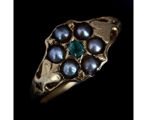 A Victorian emerald and pearl cluster flowerhead dress ring, unmarked gold settings with rectangular-cut emerald, setting hei