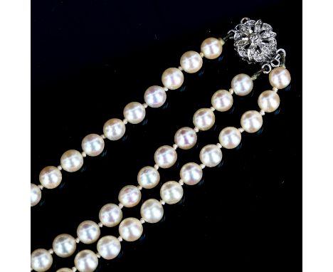 A Vintage double-strand graduated pearl necklace, with 9ct white gold diamond floral clasp, pearls measure 5.30mm - 8.91mm, n