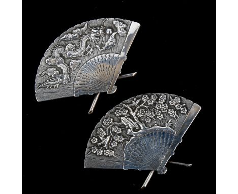 A pair of Chinese export silver fan menu card holders, by Wang Hing, late 19th/early 20th century, relief decorated with drag