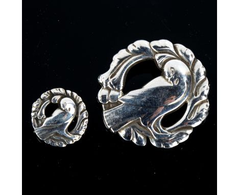 GEORG JENSEN and WENDEL - a graduated pair of Danish sterling silver dove brooches, model no. 123 and 191, largest diameter 4