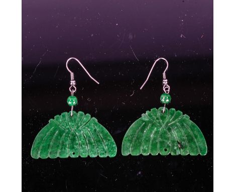 A pair of Art Deco carved jade panel drop earrings, unmarked white metal settings with shepherd hook fittings, overall height