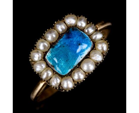 An Antique blue enamel and split pearl cluster ring, unmarked yellow metal closed back settings, setting height 11.5mm, size 