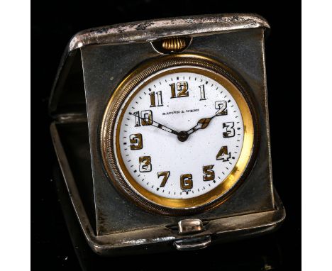 A Mappin & Webb silver-cased keyless-wind travelling clock, rectangular form with engine turned decoration, white enamel dial