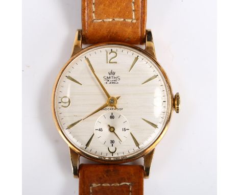 SMITHS - a Vintage 9ct gold De Luxe mechanical wristwatch, textured silvered dial with gilt quarterly Arabic numerals, subsid