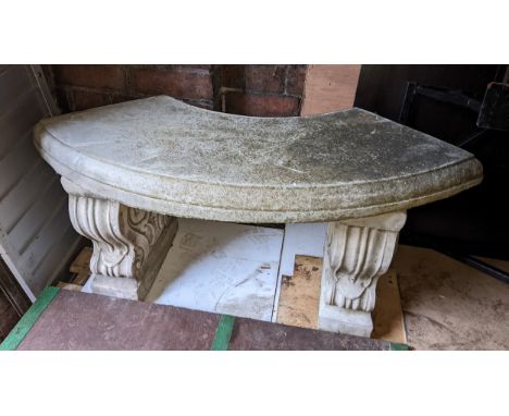 A garden stoneware bench having a bow fronted seat and with two scroll framed pedestals 45cm h x 102cm w Location: DHIf there
