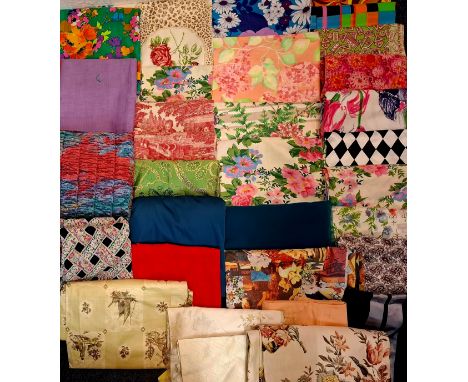 A quantity of vintage fabric remnants to include a 1986 Designers Guild 'Lilac' remnant having an orange ground with images o