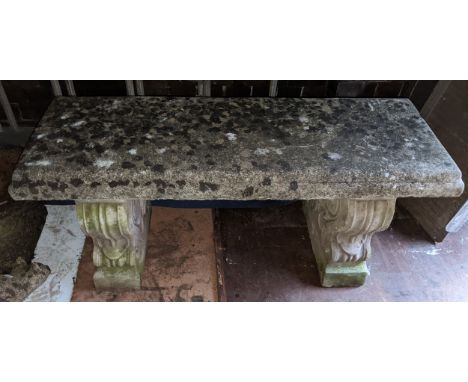 A garden stoneware bench having a rectangular seat and with two scroll formed pedestals 45cm h x 97cm w Location: DHIf there 