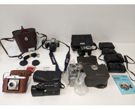 A collection of photographic equipment to include a Canon Auto Zoom 318M, an Agfa Isola 1, a Canon EOS 500, a Bell & Howell v