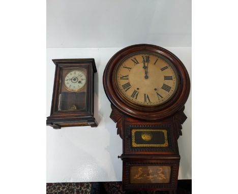 An American cased mantel clock with Roman dial and pendulum marked 'R' and 'A', together with a mahogany wall clock with Roma