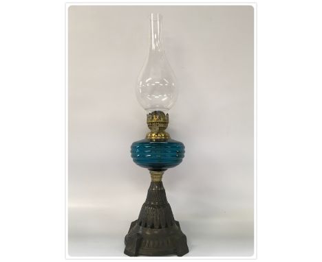ONE INCH SLIP WICK OIL LAMP, GREEN GLASS FONT, CAST BASE, CIRCA 1890-1920 (In-house packing unavailable for this lot)  