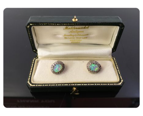 A PAIR OF OPAL STUD EARRINGS, CLAW SET STONES, SURROUNDED BY SMALL DIAMONDS, SET IN 9CT GOLD 