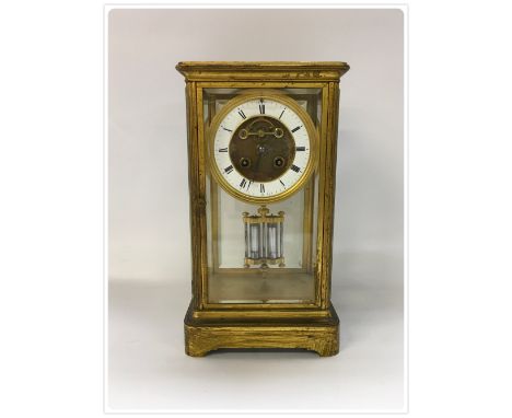VICTORIAN BRASS FOUR GLASS MANTLE CLOCK, WITH BEVELLED PLATES, STRIKING ON A BELL, MERCURY COMPENSATING PENDULUM. STAMPED 502