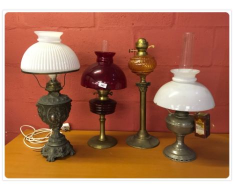 TWO BRASS OIL LAMPS, PLATED OIL LAMP WITH WHITE SHADE AND A METAL FIGURED OIL LAMP, HEAVILY EMBOSSED NOW CONVERTED TO ELECTRI