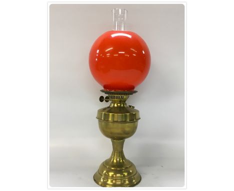 BRASS DUPLEX OIL LAMP CIRCA 1930'S WITH RED SHADE (In-house packing unavailable for this lot) 