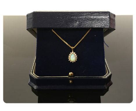 AN OPAL PENDANT, TEAR DROP SHAPED STONE, CLAW SET SURROUNDED BY TINY DIAMONDS ON AN 18CT GOLD FINE CHAIN 