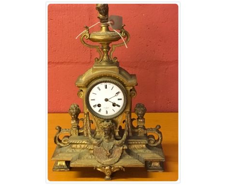 A GILT METAL MANTEL CLOCK THE FACE SIGNED HENRY MARC, PARIS, THE MOVEMENT WITH BELL CHIME (KEY AND PENDULUM WITH AUCTIONEER) 