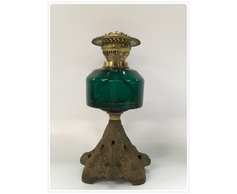 DUPLEX OIL LAMP CAST BASE REGISTERED NUMBER 1899, MOULDED GREEN GLASS FONT (In-house packing unavailable for this lot) 