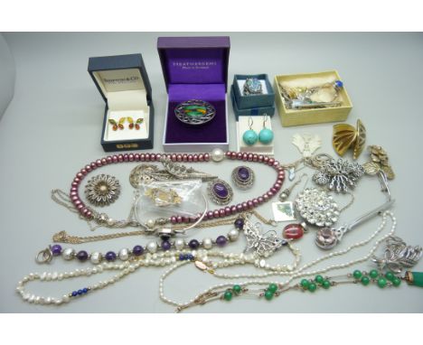 A collection of costume jewellery and silver jewellery including a silver Malcolm Gray bangle, silver brooches, two silver ri