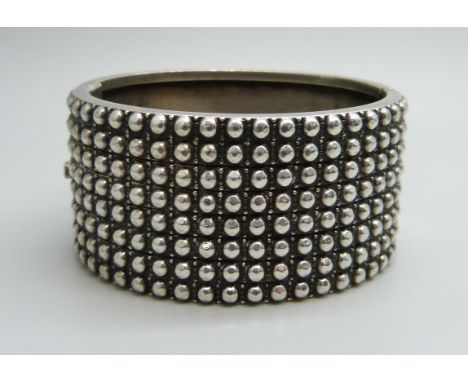An Australian silver bangle by Stokes &amp; Son, 44g, 3.1cm wide, 4.7 x 5.3cm