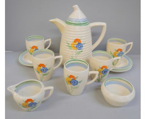 A Wilkinsons Clarice Cliff Lynton shaped coffee set, five setting, tiny chip to one cup and saucer base