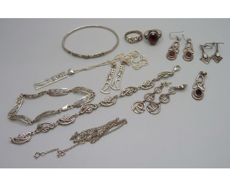 A collection of Celtic style silver jewellery including a bangle and two bracelets, 63g