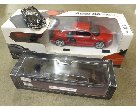 A radio controlled 1:14 scale Audi R8, a 2003 Lincoln Limousine model, and a Burago Mercedes-Benz
