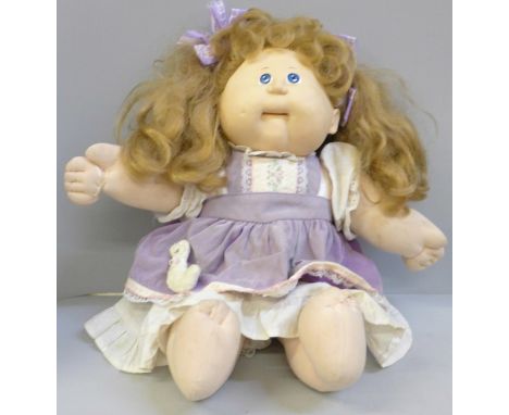A Cabbage Patch Kid T-8 marked on reverse of head 
